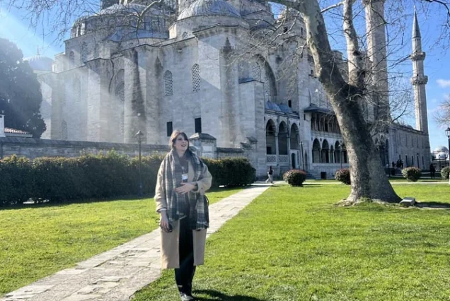 Guide walking through Sehzade Mosque garden