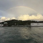 Morning Bosphorus cruise boat departing from Kabataş pier at sunrise